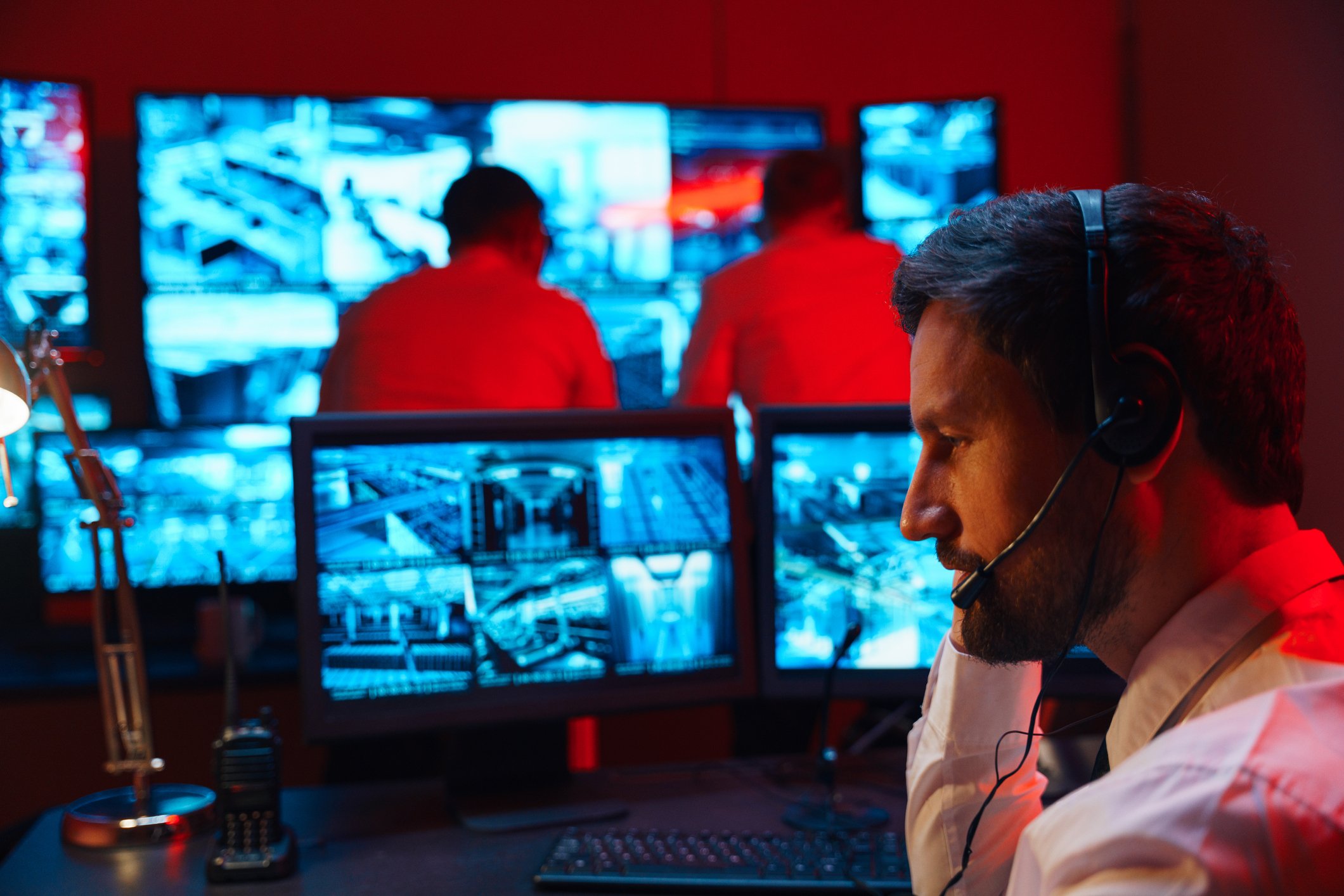 Red alarm. The offender entered the territory of the protected object. The security service calculates from the surveillance video cameras where the criminal is located. One of the guards transmits information using a wireless headset to his colleagues about how and where to look for the attacker.